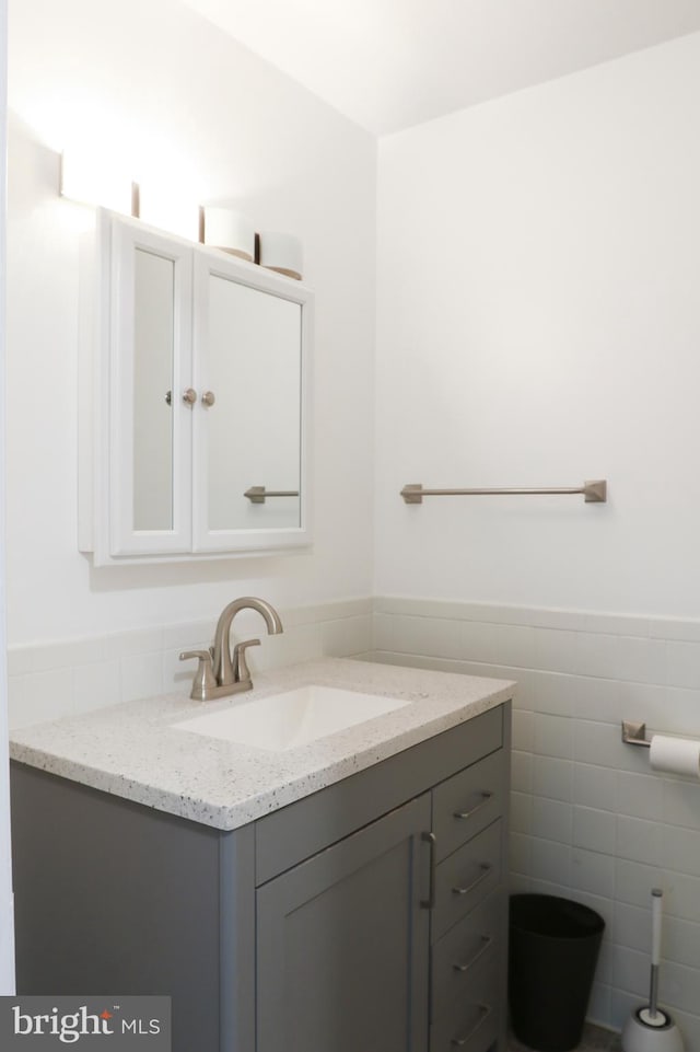 1000 Country Club Rd Unit 8, York, PA 17403 - half bathroom with vanity, tile walls, and a wainscoted wall