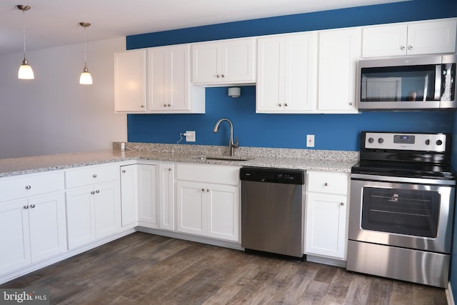 1000 Country Club Rd Unit 8, York, PA 17403 - kitchen featuring appliances with stainless steel finishes, a sink, dark wood finished floors, white cabinets, and light stone counters