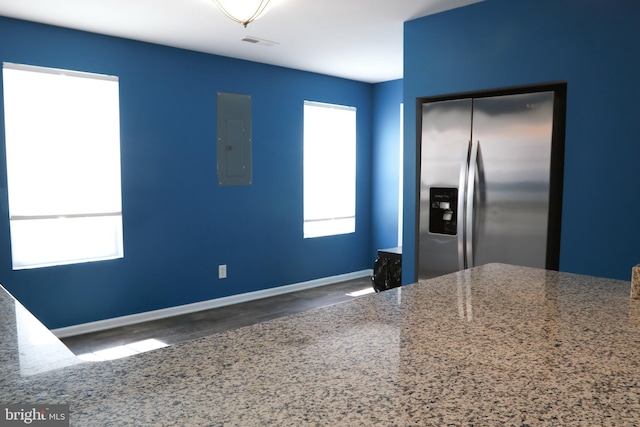 1000 Country Club Rd Unit 8, York, PA 17403 - kitchen featuring stainless steel fridge with ice dispenser, electric panel, wood finished floors, and baseboards