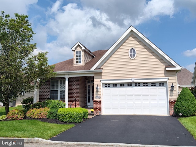 1513 Turtle Creek Ln, Quakertown, PA 18951 - view of front of home with brick siding, asphalt driveway, an attached garage, and a shingled roof