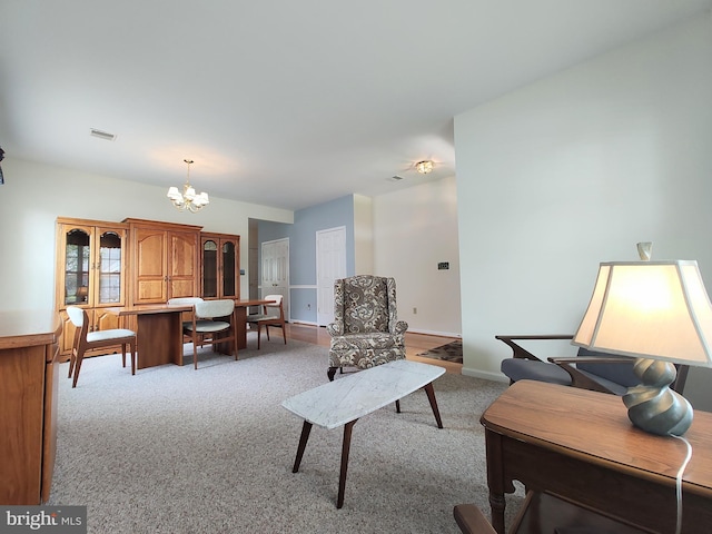 1513 Turtle Creek Ln, Quakertown, PA 18951 - living area with light carpet, a chandelier, and baseboards