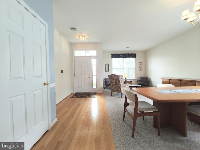 1513 Turtle Creek Ln, Quakertown, PA 18951 - dining area featuring light wood-type flooring, a chandelier, and baseboards