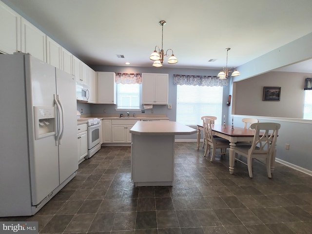 1513 Turtle Creek Ln, Quakertown, PA 18951 - kitchen with white appliances, a sink, a chandelier, white cabinets, and light countertops