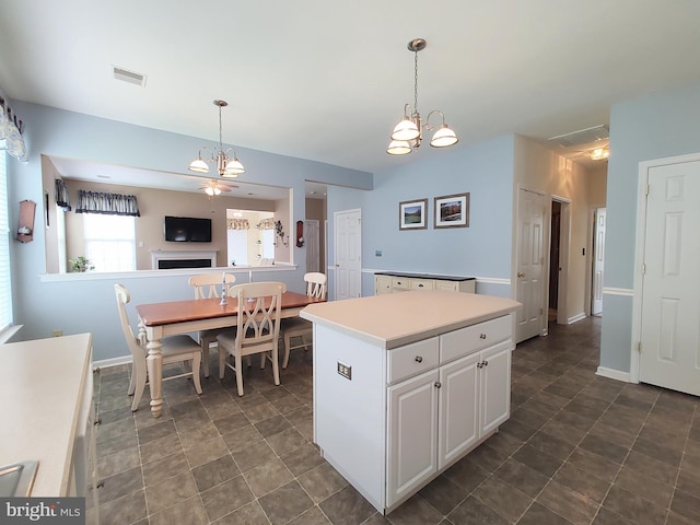 1513 Turtle Creek Ln, Quakertown, PA 18951 - kitchen with white cabinetry, hanging light fixtures, a kitchen island, light countertops, and a chandelier