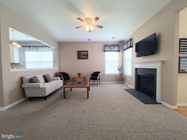 1513 Turtle Creek Ln, Quakertown, PA 18951 - carpeted living room featuring plenty of natural light, a ceiling fan, a fireplace with flush hearth, and baseboards