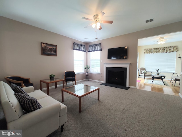 1513 Turtle Creek Ln, Quakertown, PA 18951 - carpeted living room featuring ceiling fan, a fireplace with flush hearth, and baseboards