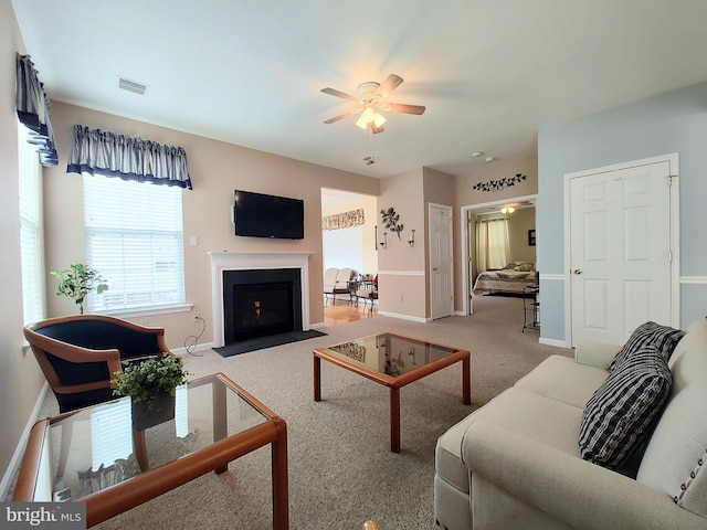1513 Turtle Creek Ln, Quakertown, PA 18951 - living room featuring ceiling fan, carpet flooring, baseboards, and a fireplace with flush hearth