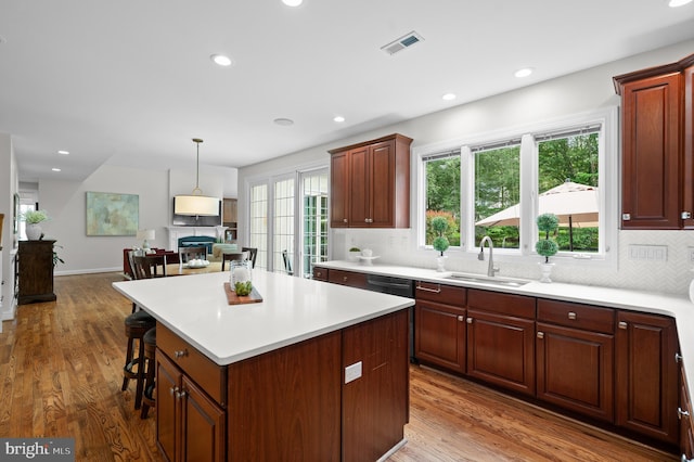 704 Turnbridge Rd, Wayne, PA 19087 - kitchen featuring a sink, decorative backsplash, wood finished floors, light countertops, and recessed lighting