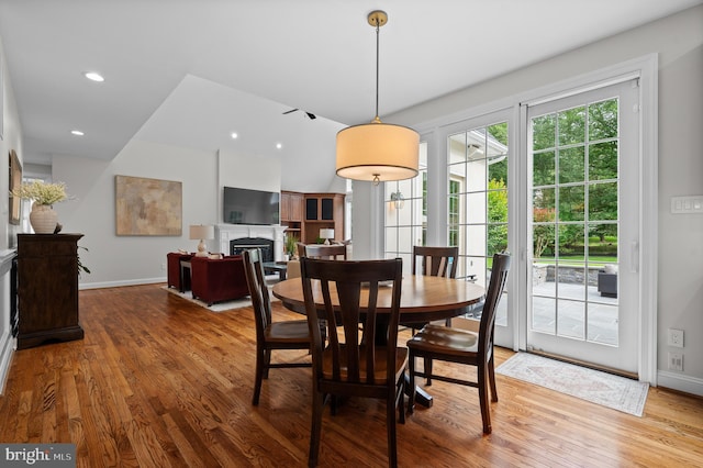 704 Turnbridge Rd, Wayne, PA 19087 - dining area featuring wood finished floors, baseboards, a glass covered fireplace, and recessed lighting
