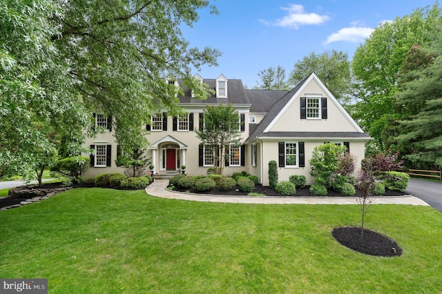704 Turnbridge Rd, Wayne, PA 19087 - georgian-style home featuring stucco siding and a front yard