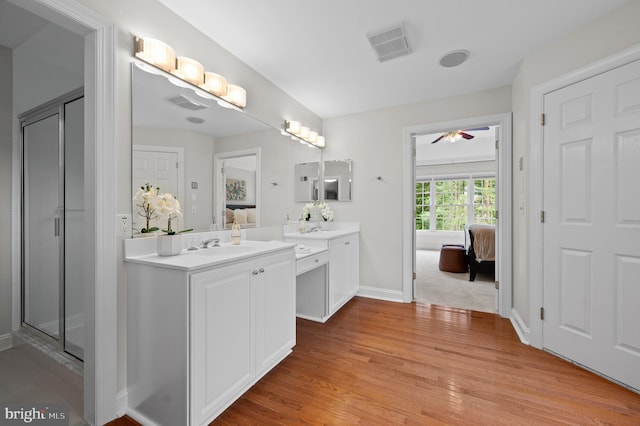 704 Turnbridge Rd, Wayne, PA 19087 - full bathroom with connected bathroom, wood finished floors, vanity, a ceiling fan, and baseboards