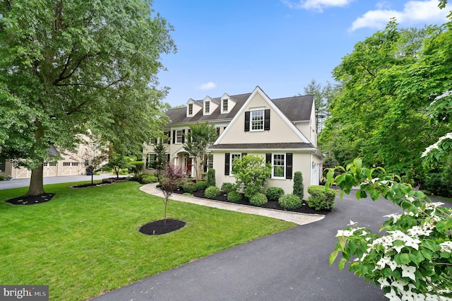 704 Turnbridge Rd, Wayne, PA 19087 - view of front facade featuring stucco siding and a front lawn