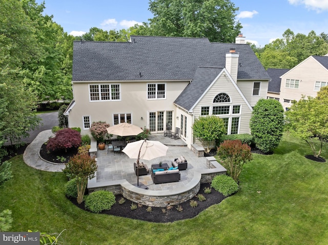 704 Turnbridge Rd, Wayne, PA 19087 - back of house featuring a patio, a chimney, a yard, roof with shingles, and outdoor lounge area