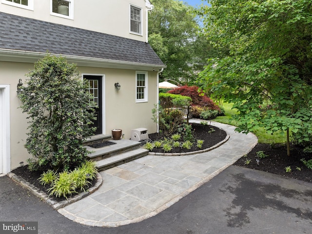 704 Turnbridge Rd, Wayne, PA 19087 - view of exterior entry with stucco siding and a shingled roof