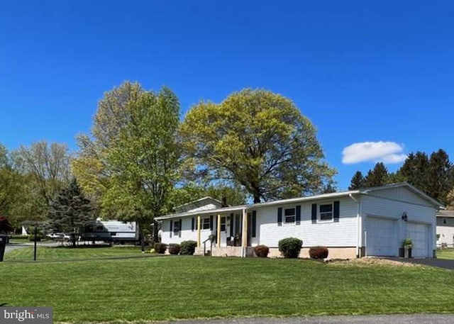 230 Eisenhower Dr, Orwigsburg, PA 17961 - single story home with an attached garage, a front lawn, and asphalt driveway