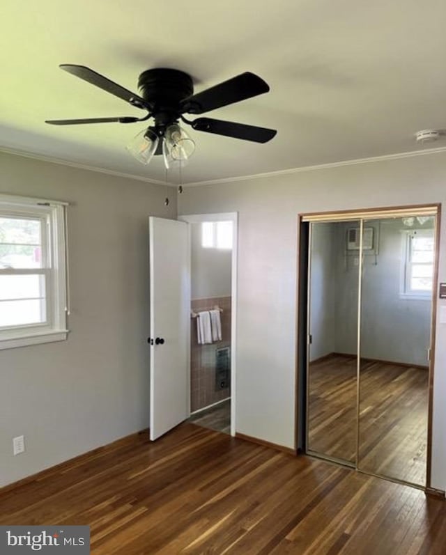 230 Eisenhower Dr, Orwigsburg, PA 17961 - unfurnished bedroom featuring wood finished floors, crown molding, a closet, and ceiling fan