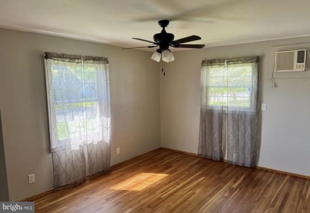 230 Eisenhower Dr, Orwigsburg, PA 17961 - spare room with a wall mounted air conditioner, healthy amount of natural light, wood finished floors, and ceiling fan