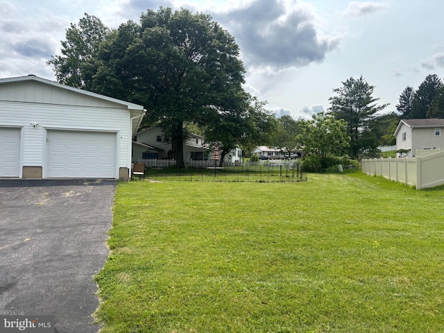 230 Eisenhower Dr, Orwigsburg, PA 17961 - view of yard with asphalt driveway and a garage