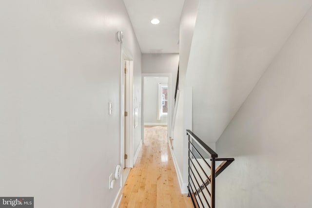 939 Sigel St, Philadelphia, PA 19148 - corridor with an upstairs landing, light wood finished floors, recessed lighting, and baseboards