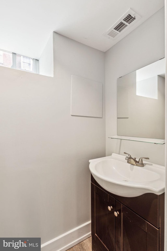 939 Sigel St, Philadelphia, PA 19148 - bathroom with vanity, wood finished floors, and baseboards