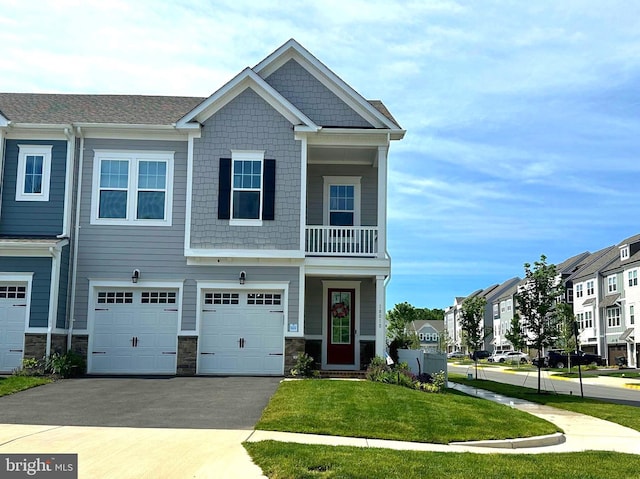 18010 Woods Overlook Dr, Dumfries, VA 22026 - view of front of home featuring driveway, a garage, and a front lawn