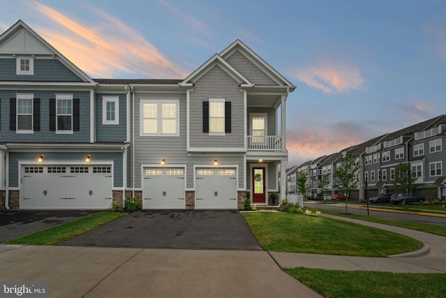 18010 Woods Overlook Dr, Dumfries, VA 22026 - view of property featuring driveway, a balcony, a garage, and stone siding