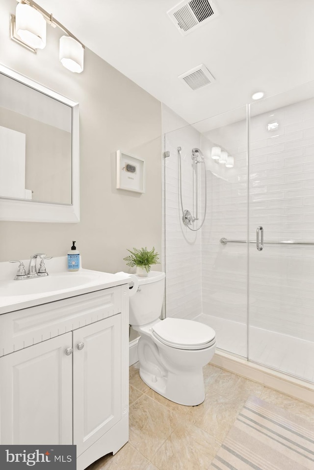 1801 Park Rd NW Unit 2, Washington, DC 20010 - bathroom featuring toilet, vanity, a shower stall, and tile patterned flooring