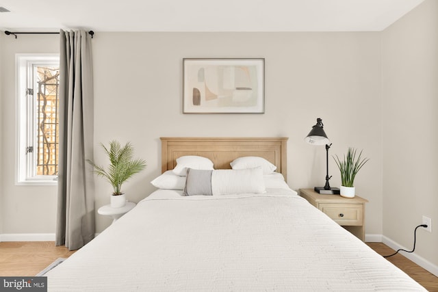 1801 Park Rd NW Unit 2, Washington, DC 20010 - bedroom featuring baseboards and wood finished floors