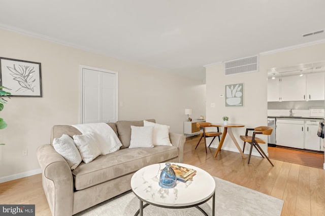 1801 Park Rd NW Unit 2, Washington, DC 20010 - living area featuring light wood finished floors, crown molding, and baseboards