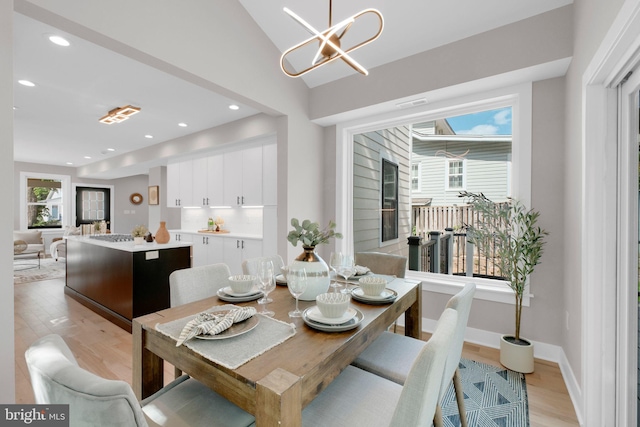 1427 Jackson St NE, Washington, DC 20017 - dining area with light wood-style flooring, a chandelier, recessed lighting, baseboards, and vaulted ceiling