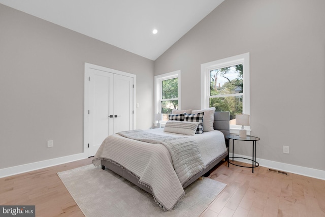1427 Jackson St NE, Washington, DC 20017 - bedroom with baseboards, high vaulted ceiling, light wood-style floors, recessed lighting, and a closet