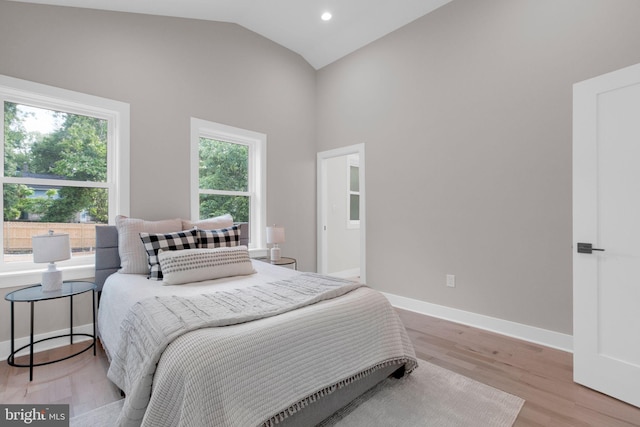 1427 Jackson St NE, Washington, DC 20017 - bedroom with light wood-style flooring, baseboards, recessed lighting, and high vaulted ceiling
