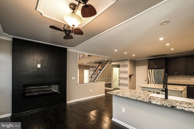 22 Thaxton Ct, Stafford, VA 22556 - kitchen featuring freestanding refrigerator, ornamental molding, baseboards, ceiling fan, and a sink