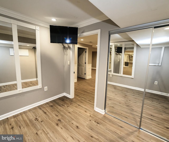 22 Thaxton Ct, Stafford, VA 22556 - unfurnished bedroom featuring crown molding, recessed lighting, wood finished floors, baseboards, and a closet