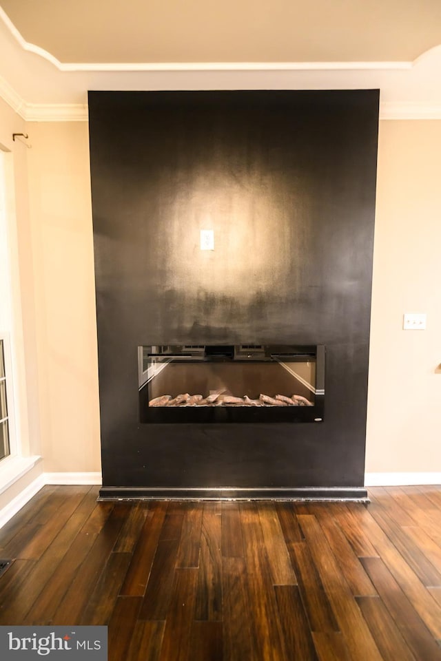 22 Thaxton Ct, Stafford, VA 22556 - detailed view of wood finished floors, crown molding, a glass covered fireplace, and baseboards