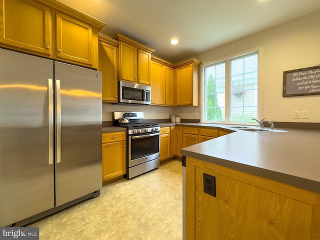 312 Sagamore Hl, Mount Joy, PA 17552 - kitchen with stainless steel appliances, a sink, recessed lighting, dark countertops, and brown cabinets