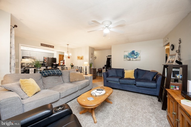 100 Winding Way Unit A-23, Downingtown, PA 19335 - living room featuring ceiling fan, a chandelier, and carpet flooring