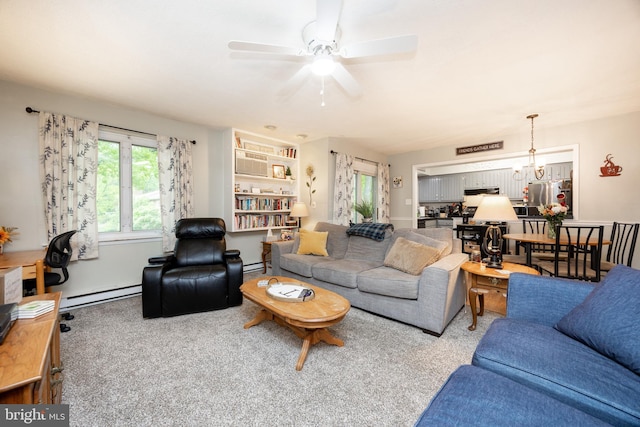 100 Winding Way Unit A-23, Downingtown, PA 19335 - living room featuring a baseboard heating unit, a ceiling fan, and carpet floors