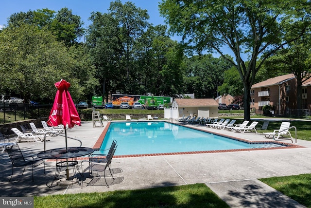 100 Winding Way Unit A-23, Downingtown, PA 19335 - community pool with a patio area and view of wooded area