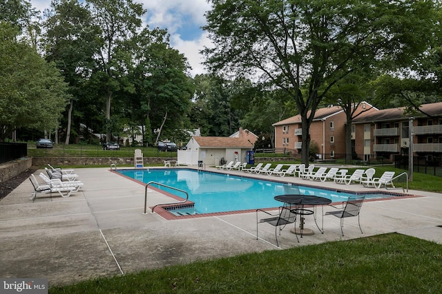 100 Winding Way Unit A-23, Downingtown, PA 19335 - community pool with a patio area and view of wooded area