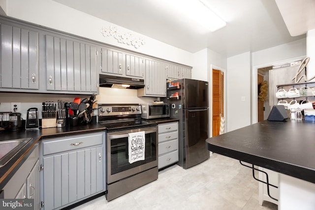 100 Winding Way Unit A-23, Downingtown, PA 19335 - kitchen with appliances with stainless steel finishes, under cabinet range hood, dark countertops, and gray cabinetry