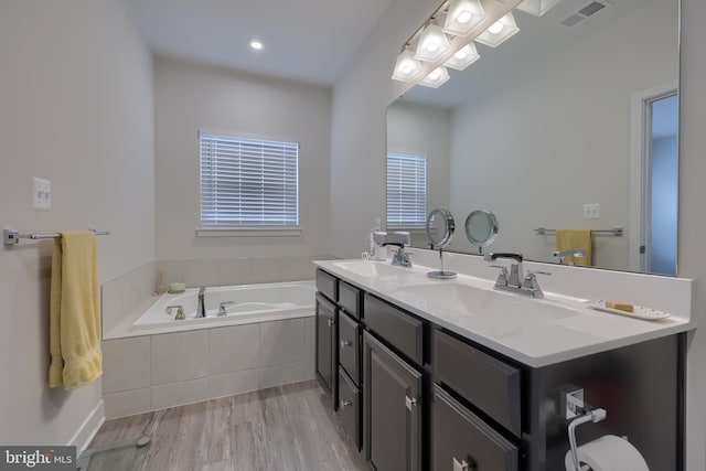 1032 Rosecroft Ln Unit 15, York, PA 17403 - full bath with a garden tub, double vanity, and wood finished floors