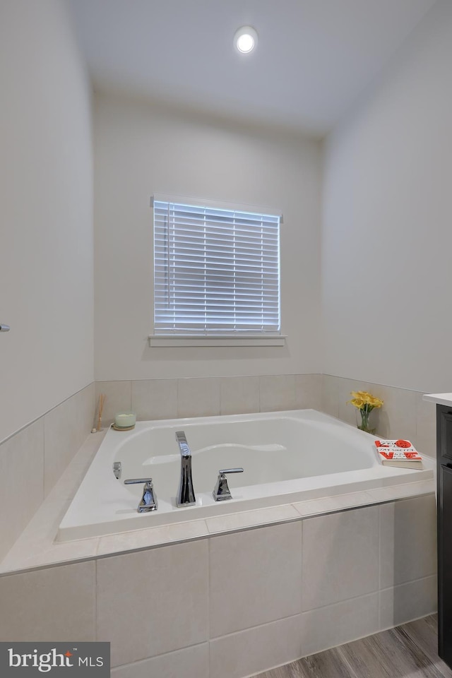 1032 Rosecroft Ln Unit 15, York, PA 17403 - full bathroom featuring a bath, vanity, and wood finished floors