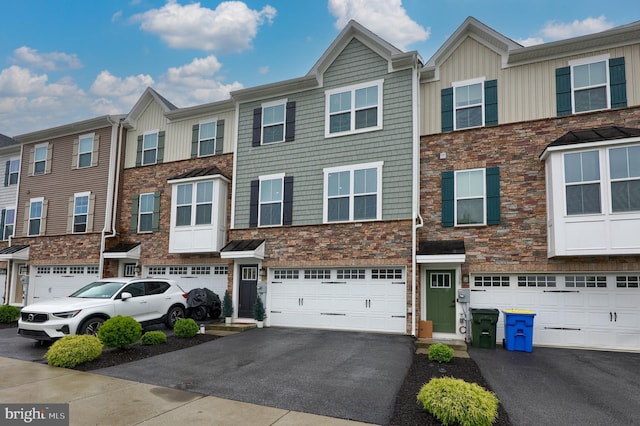 1032 Rosecroft Ln Unit 15, York, PA 17403 - view of property with driveway, a garage, board and batten siding, and stone siding