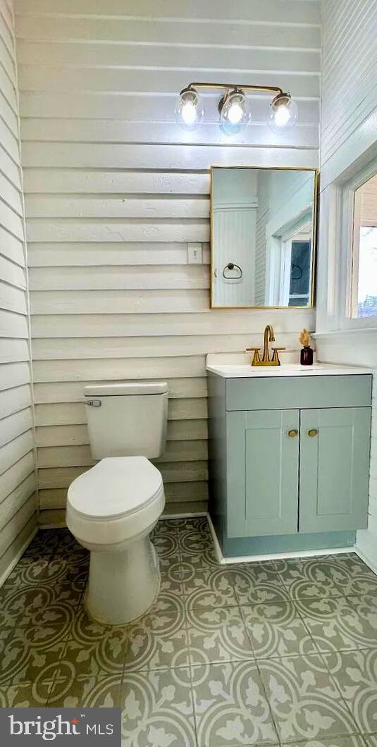933 Mccormick Blvd, Clifton Forge, VA 24422 - bathroom with toilet, vanity, and tile patterned flooring