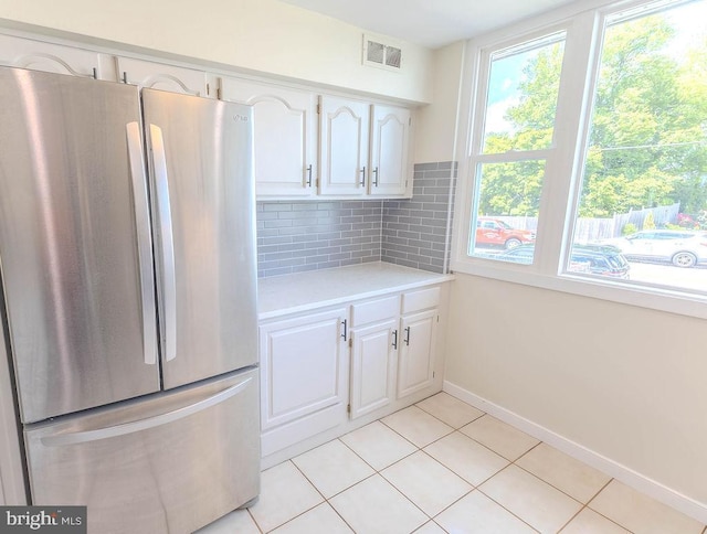4128 Whiting Rd, Philadelphia, PA 19154 - kitchen featuring freestanding refrigerator, light countertops, plenty of natural light, and white cabinetry