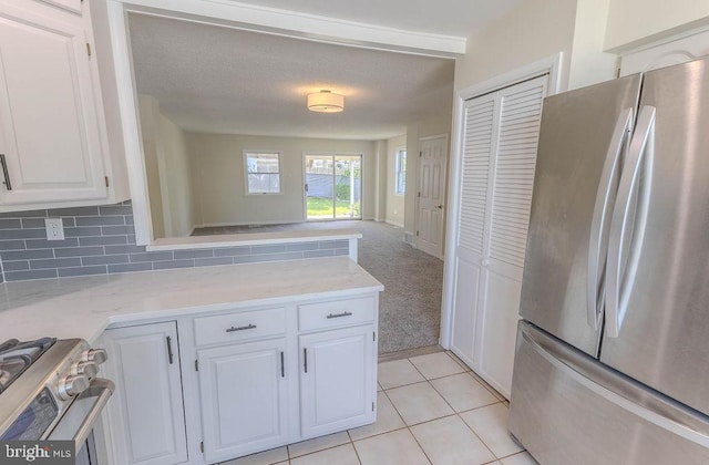 4128 Whiting Rd, Philadelphia, PA 19154 - kitchen with stainless steel appliances, light countertops, white cabinets, a peninsula, and open floor plan