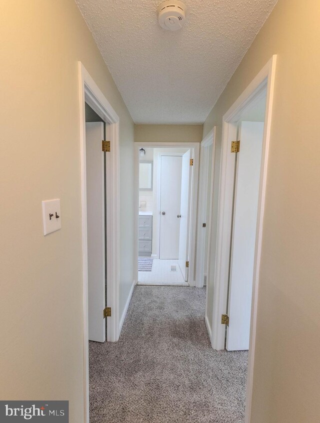 4128 Whiting Rd, Philadelphia, PA 19154 - hallway with carpet flooring, a textured ceiling, and baseboards