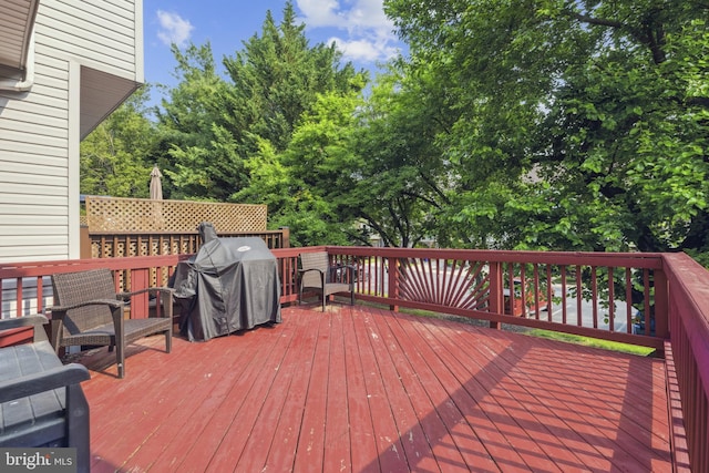 7140 Ladd Cir, Frederick, MD 21703 - wooden terrace with a grill and view of scattered trees