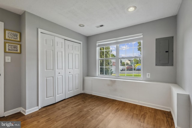 7140 Ladd Cir, Frederick, MD 21703 - unfurnished bedroom with electric panel, baseboards, and wood finished floors